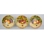 A fine set of three Royal Worcester plates, painted with apples, peaches, by P. Lynes, signed,