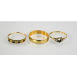 A 9ct gold wedding band, and two 9ct gold rings A/F, 4.6g total weight.