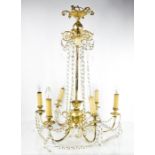 A 20th century silvered six branch chandelier, with scrolling arms, ceiling rose, and crystal