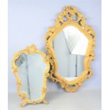 Two plasterwork gold painted mirrors, with scrollwork frames.