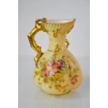 A Royal Worcester blush ivory coral handle jug with painted wild flowers and gilding, date code