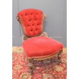 A Victorian velvet upholstered nursing chair