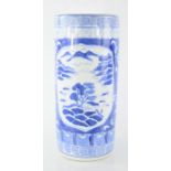 A Chinese blue and white umbrella stand, of cylindrical form decorated with mountain scenes, 45cm