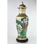 A 19th century Chinese famille verte vase and cover, decorated with figures and landscapes and