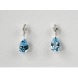 A pair of 18ct aquamarine and diamond earrings, the aquamarines total 3.22ct, and the diamonds 0.