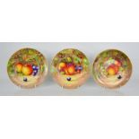A fine set of three Royal Worcester plates, painted with apples, blackberries, peaches, by J Cook,