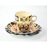 A Royal Crown Derby coffee can and saucer numbered 2451, and a trio in the Old Imari pattern.
