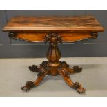 A William IV Rosewood fold over card table with original red baize of circular form, with scroll