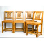Robert Thompson 'The Mouseman' set of four dining chairs with lattice carved backs and tan leather