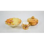 A Royal Worcester blush ivory trinket box and cover, painted with flowers, date code 1920,