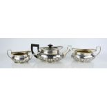 A fine George III three piece tea set, with Greek key pattern and gadrooned bases, comprising tea