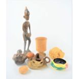 A wooden African figurine together with a group of treen and a Muggins pottery mug