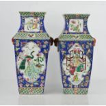 A pair of 19th century Chinese canton vases, decorated with figures and peacocks, exotic birds and
