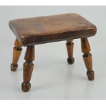 A 19th century oak milking stool