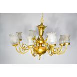 A French style gilt brass chandelier with glass shades and eight branches.