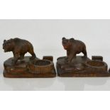 A pair of Blackforest bears, standing on rocks, one with inscription of St Moritz, the other Chateau