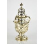 A silver Victorian sugar castor of baluster form, with embossed folate decoration by William Caffe