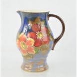 A Royal Doulton pitcher in the "Wild Rose" pattern