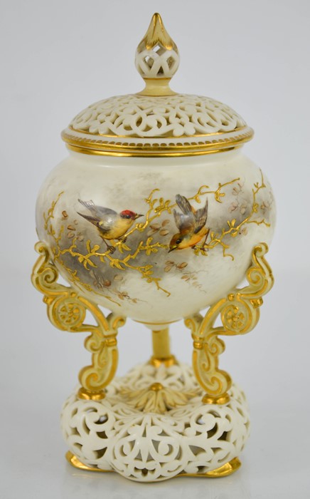A Royal Worcester Grainger ivory ground pot pourri vase and cover, circa 1890, painted with birds,