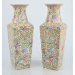 A pair of Chinese vases decorated with butterflies, character mark to base. 31.5cm