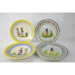 Two pairs of French Quimper pottery plates, all depicting figures and signed Henriot Quimper to