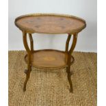 An Edwardian oval mahogany and walnut marquetry etagere, circa 1905, the top decorated with