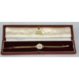 A 9ct gold ladies wristwatch, by Garrard & Co, London, in the original box, 17g total.