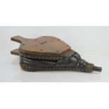 An antique oak and leather hand bellows