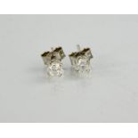 A pair of 18ct white gold and diamond earrings, the brilliant cut diamonds each approximately 0.