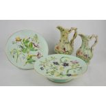 Two Victorian stone ware jugs and two comports decorated with flowers on pale green ground.