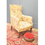 A 19th century armchair and footstool.