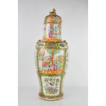 A 19th century Cantonese baluster vase and cover with mythical beast finials and mask with loop