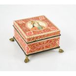 An Indian wooden box, painted with a portrait roundel to the lid and raised on four gilded feet.