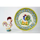 A French Quimper pottery plate depicting a cockerel and numbered 106, together with a Portuguese