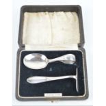A sterling silver christening set, spoon and pusher