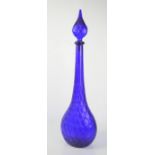 A large blue glass apothecary bottle with stopper. 65cms