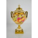 A fine Royal Worcester vase and cover, painted with apples, blackberries, peaches and grapes, twin