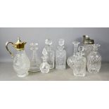 A group of seven cut glass decanters, and stoppers, together with two cut glass jugs.