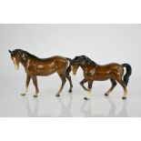 Two Beswick horses, two mares in brown, 15cm and 17cm high.