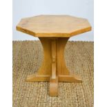 A Robert Thompson Mouseman oak coffee table with adzed top, carved with trademark mouse.