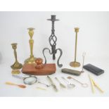 A silver tea spoon, salt spoon, knife, bone glove stretchers, blotter, and a group of candlesticks.