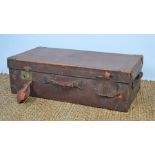 A large antique leather travelling trunk