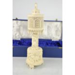 An Indian ivory table lamp base, with pierced cylindrical form shade, the stem carved with