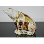 A Royal Crown Derby paperweight, in the form of a polar bear.