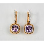 An 18ct rose and white gold, diamond and amethyst earrings, the amethyst approximately 2ct total,