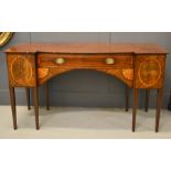 A 19th century Sheraton period mahogany breakfront sideboard, with satinwood inlaid to the top,