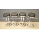 A group of four chrome effect stools