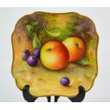 A Royal Worcester square shaped dish, date code 1935, painted with fruit on mossy ground, signed A