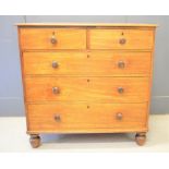 A Victorian mahogany chest of drawers, two over three long graduated drawers, raised on bun feet.