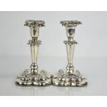 A pair of silver candlesticks, Birmingham 1901, maker W&H, 18cm high, weighted base total 25.5toz.